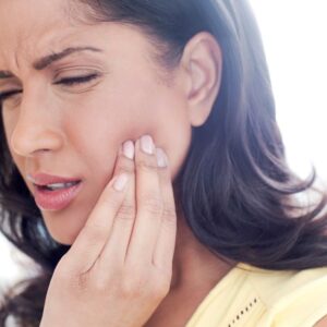 Woman with jaw pain